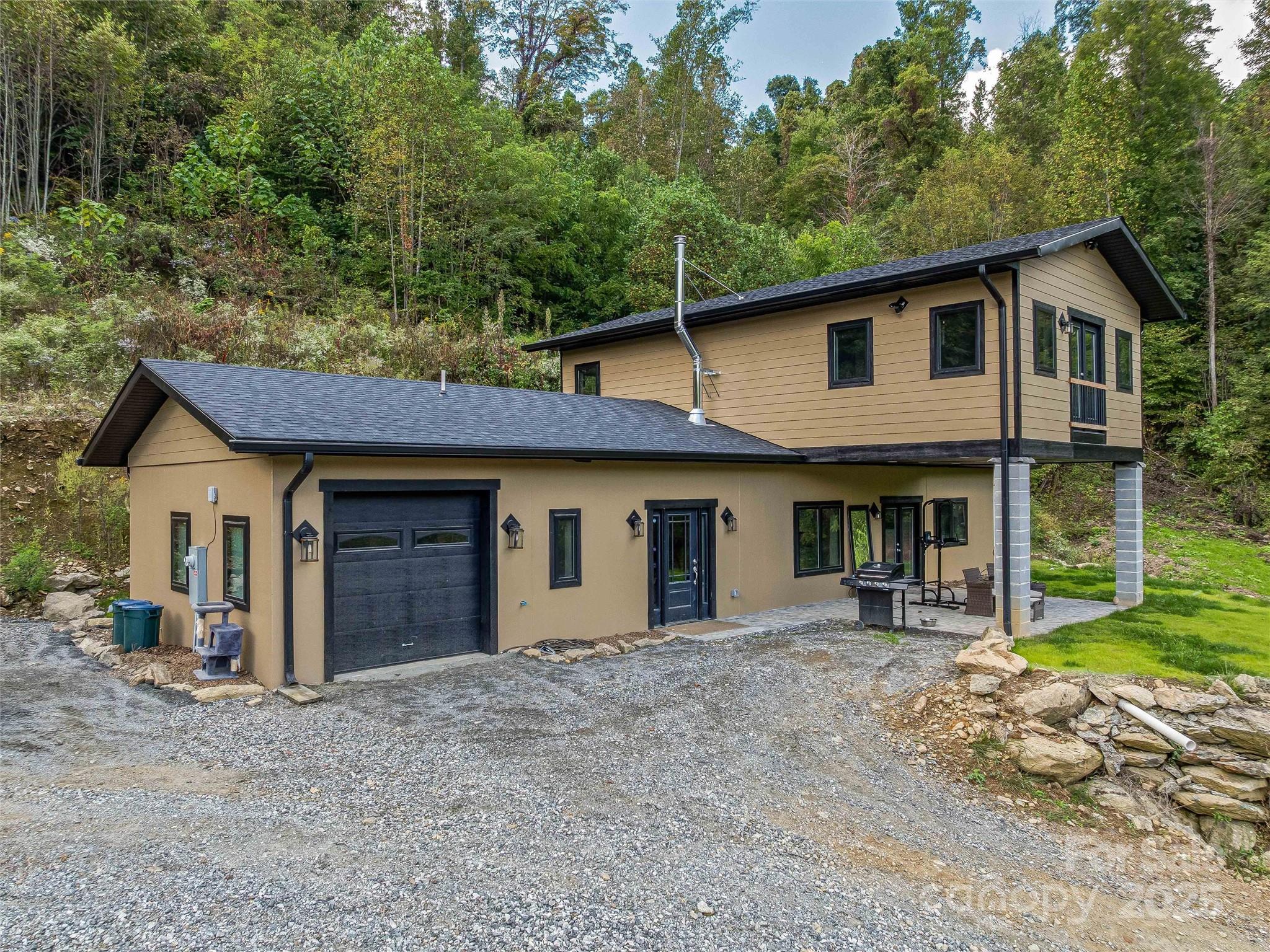 945 Roaring Fork Road Hot Springs, NC 28743 - Photo 4 of 48 a view of a house with a yard and large tree