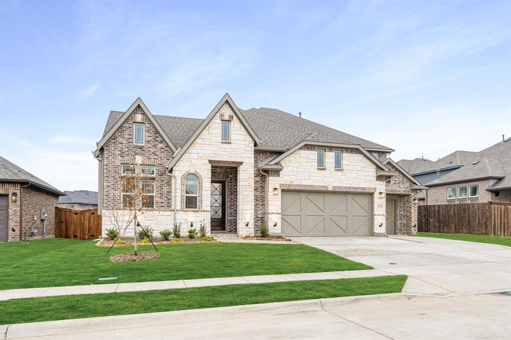2824 Spg Vly Way Anna, TX 75409 - Photo 3 of 40 a front view of a house with a yard and garage