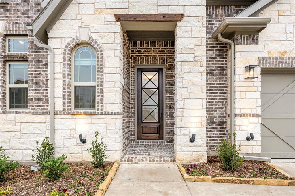 2824 Spg Vly Way Anna, TX 75409 - Photo 4 of 40 a front view of a house with large windows