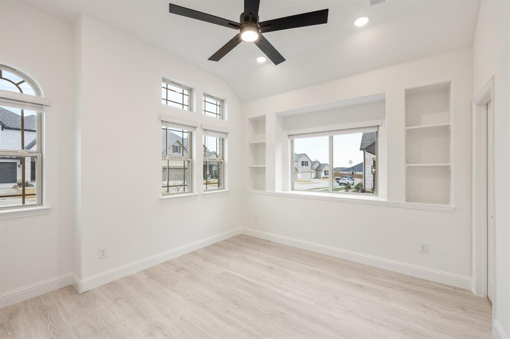 2824 Spg Vly Way Anna, TX 75409 - Photo 6 of 40 a view of an empty room with a window and wooden floor