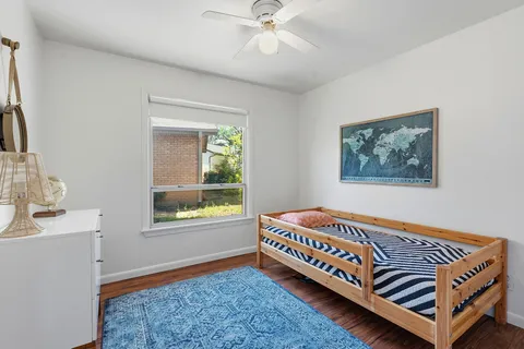 a room with a bed and a window