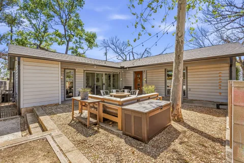 a view of a dinning table and chair in the patio