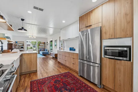 a view of house with backyard