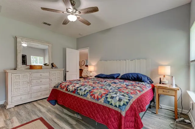 a bedroom with a bed and a dresser