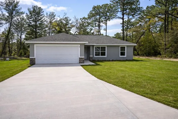 front view of a house with a yard
