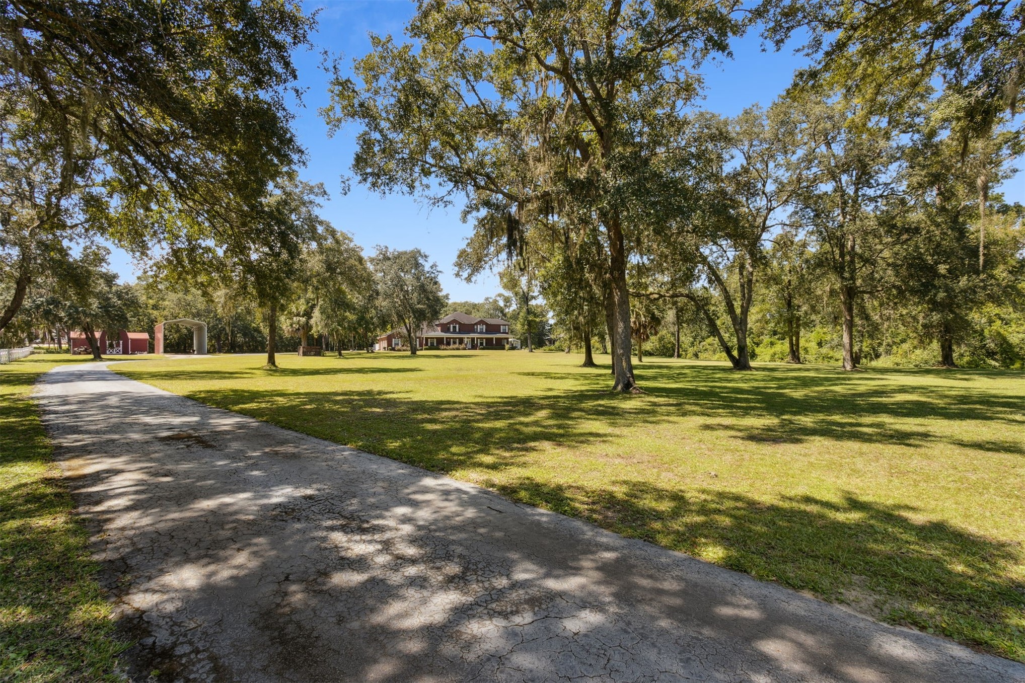 87377 Raddin Road Yulee, FL 32097 - Photo 5 of 75 a view of a swimming pool with an outdoor space and seating