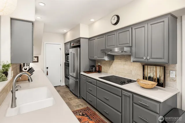 a spacious bedroom with a bed and a couch