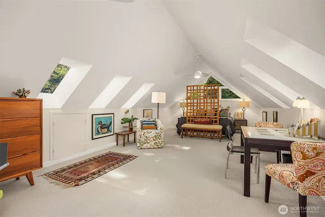 a dining room with furniture and a flat screen tv