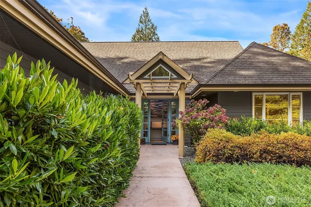 a front view of a house with outdoor seating