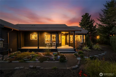 a backyard of a house with yard barbeque oven and outdoor seating