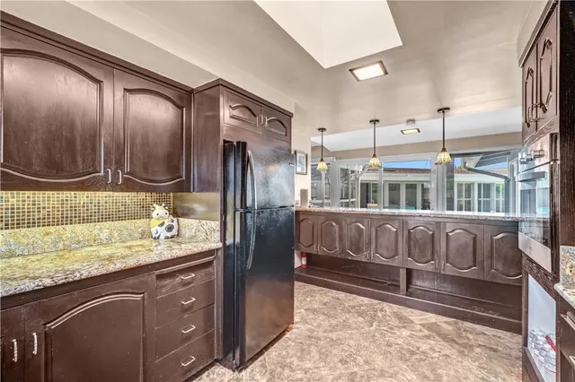 a bathroom with double vanity and a mirror
