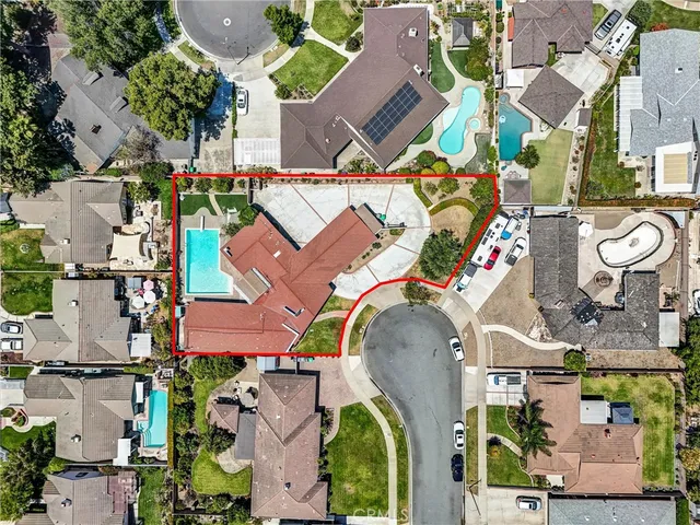 an aerial view of houses with outdoor space