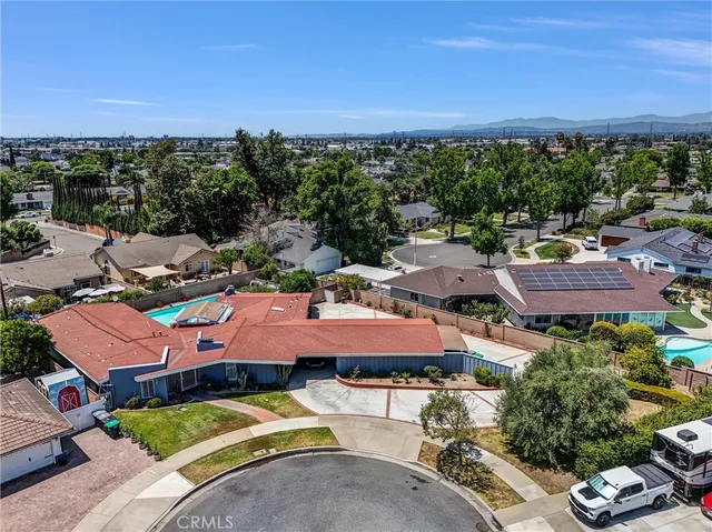 a view of a swimming pool and lounge chairs