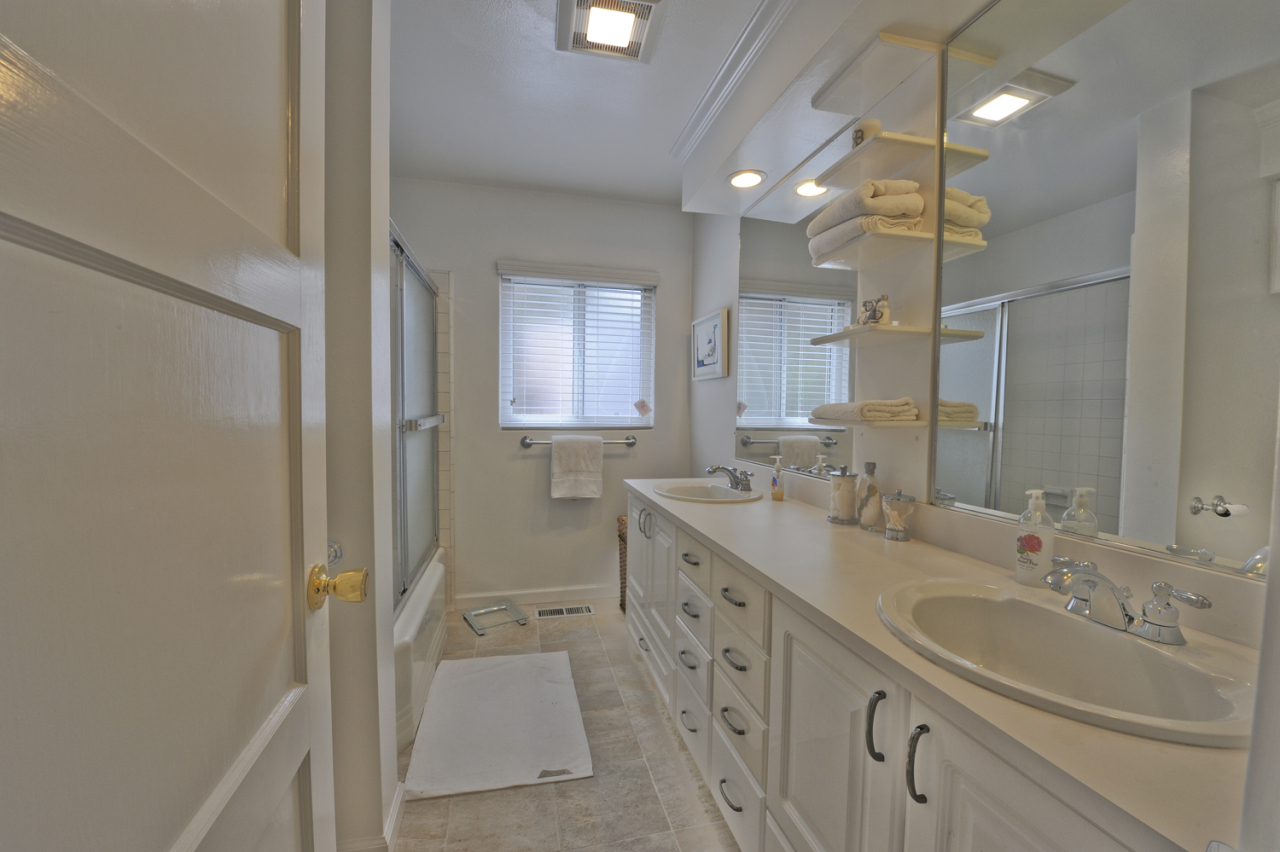 1368-1370 Virginia Road Montecito, CA 93108 - Photo 12 of 13 a bathroom with a double vanity sink mirror and double