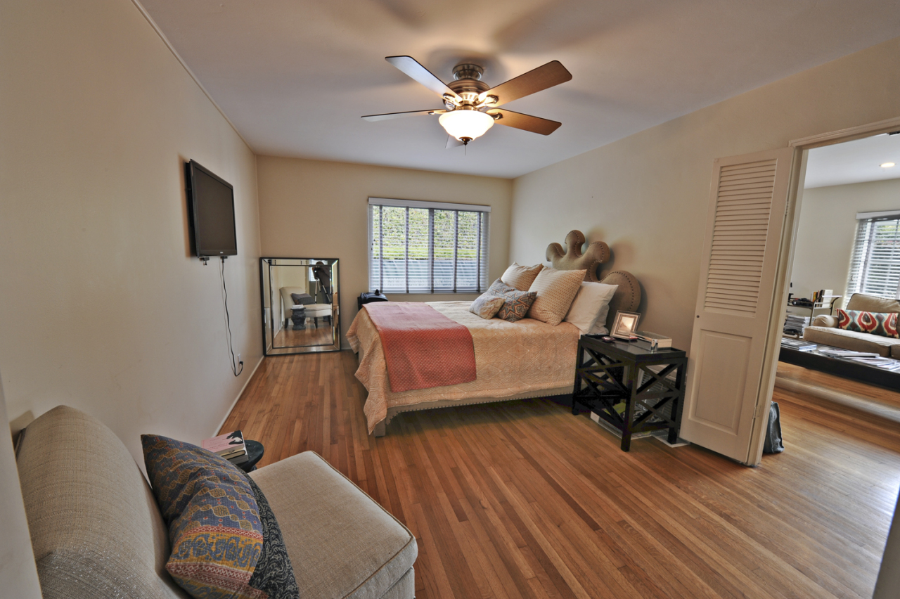 1368-1370 Virginia Road Montecito, CA 93108 - Photo 5 of 13 a bedroom with a bed and wooden floor