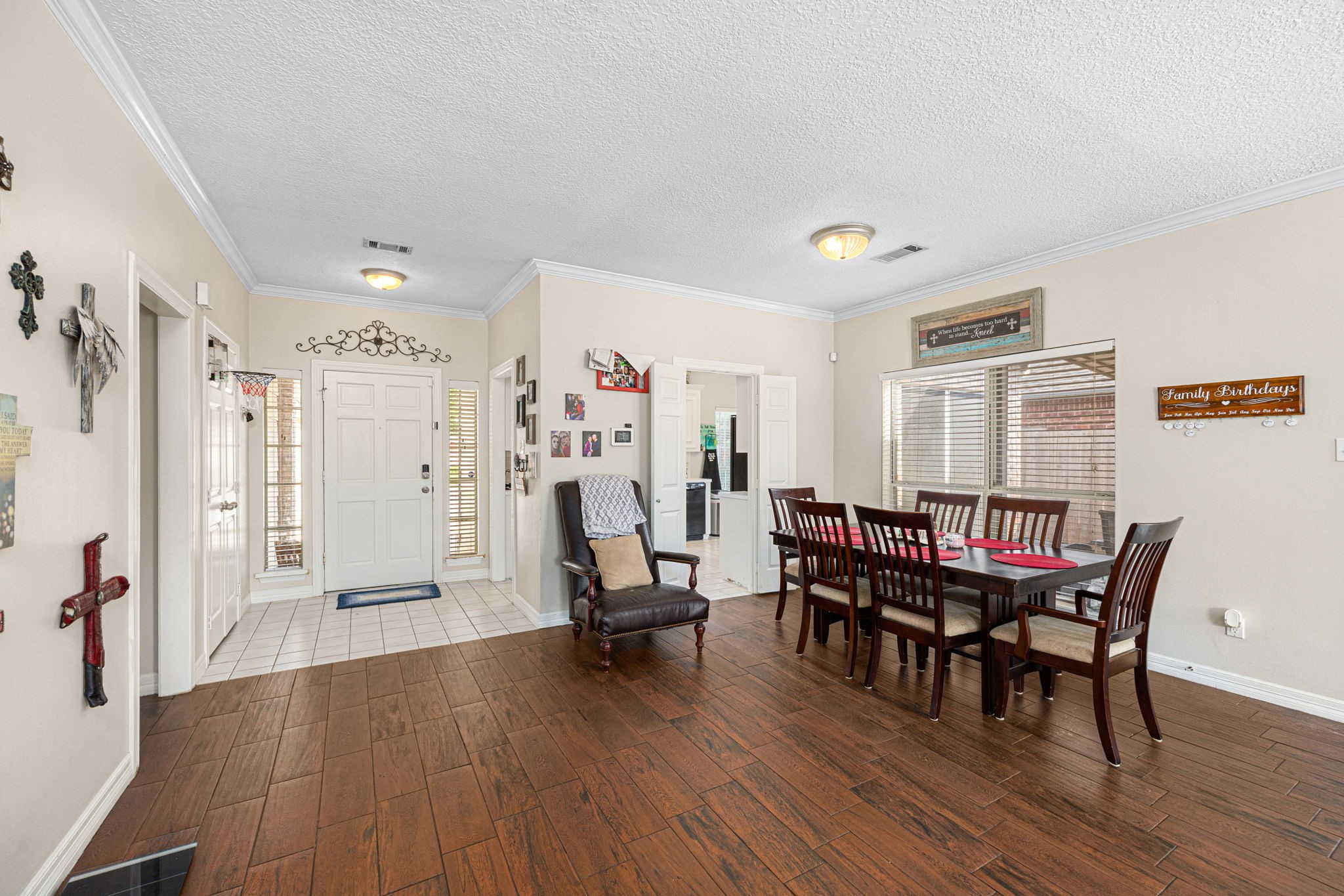 7202 North Fawn River Circle Spring, TX 77379 - Photo 11 of 23 a view of a dining room with furniture and wooden floor