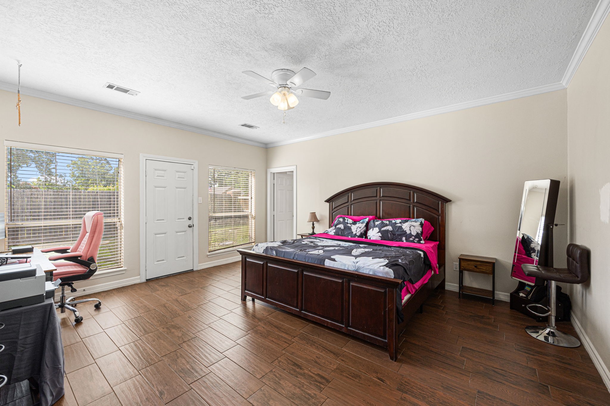 7202 North Fawn River Circle Spring, TX 77379 - Photo 13 of 23 a bedroom with a bed and wooden floor