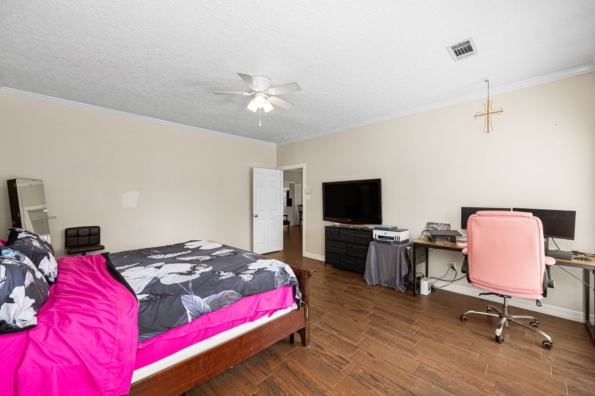 7202 North Fawn River Circle Spring, TX 77379 - Photo 14 of 23 a bedroom with a bed and a flat screen tv