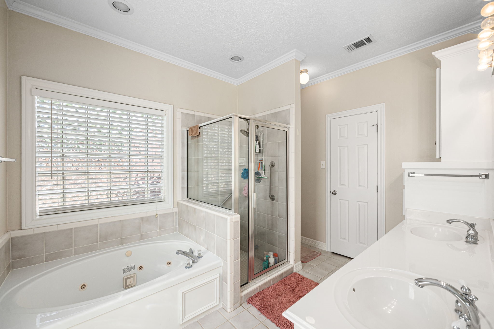 7202 North Fawn River Circle Spring, TX 77379 - Photo 16 of 23 a bathroom with a bathtub and a shower