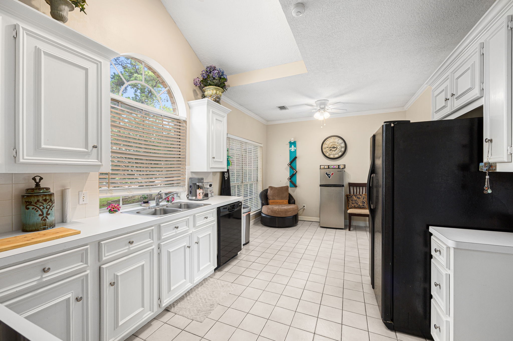 7202 North Fawn River Circle Spring, TX 77379 - Photo 9 of 23 a kitchen with a sink cabinets and window