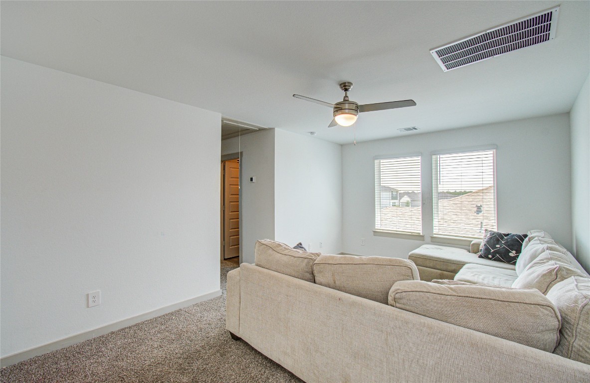 22 Desert Spring Lane Manvel, TX 77578 - Photo 32 of 39 a living room with furniture and a window
