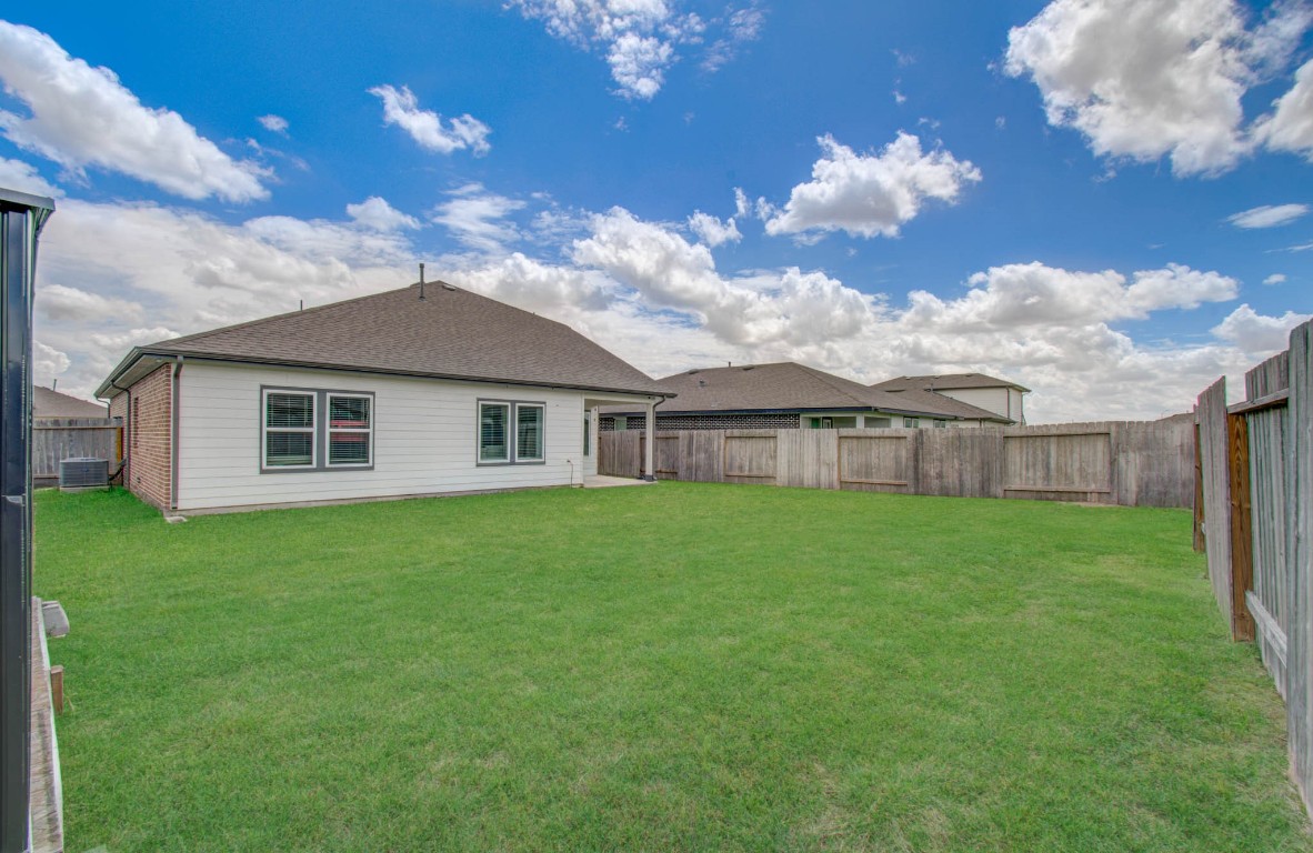 22 Desert Spring Lane Manvel, TX 77578 - Photo 37 of 39 a view of a house with a big yard