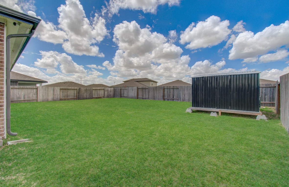 22 Desert Spring Lane Manvel, TX 77578 - Photo 38 of 39 a view of a house with a backyard