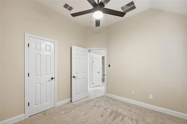 an empty room with closet area