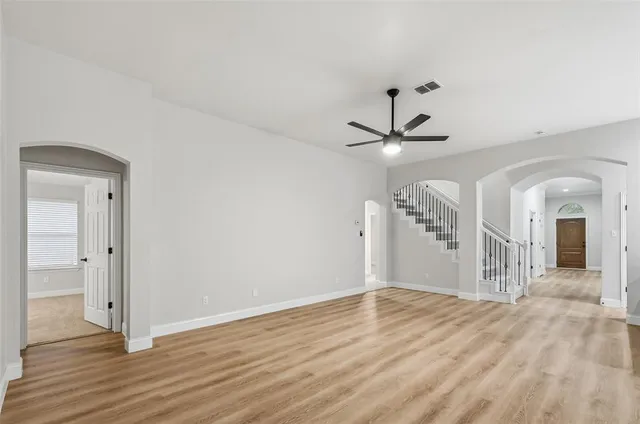 a view of a livingroom with wooden floor