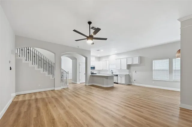 a view of a kitchen with sink and cabinets
