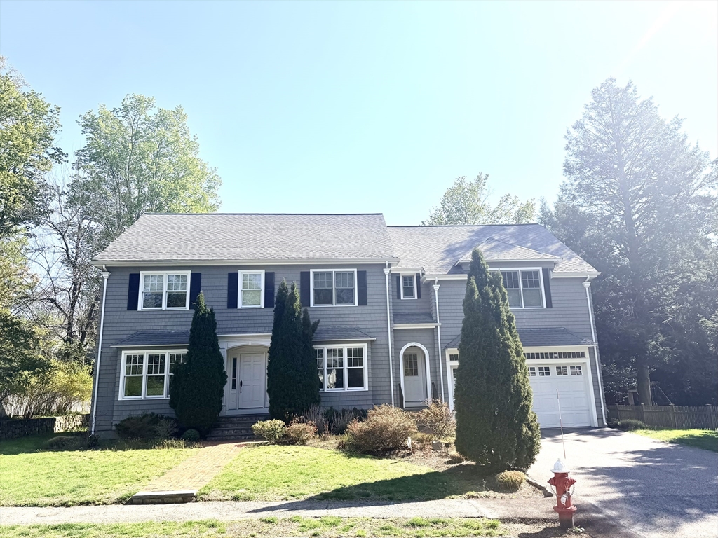 65 Denton Road Wellesley, MA 02482 - Photo 1 of 16 a front view of a house with a yard