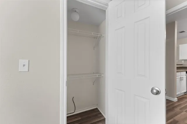 a view of a room with racks on the wall