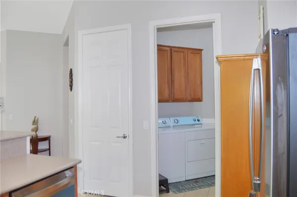 a bedroom with a bed and chair