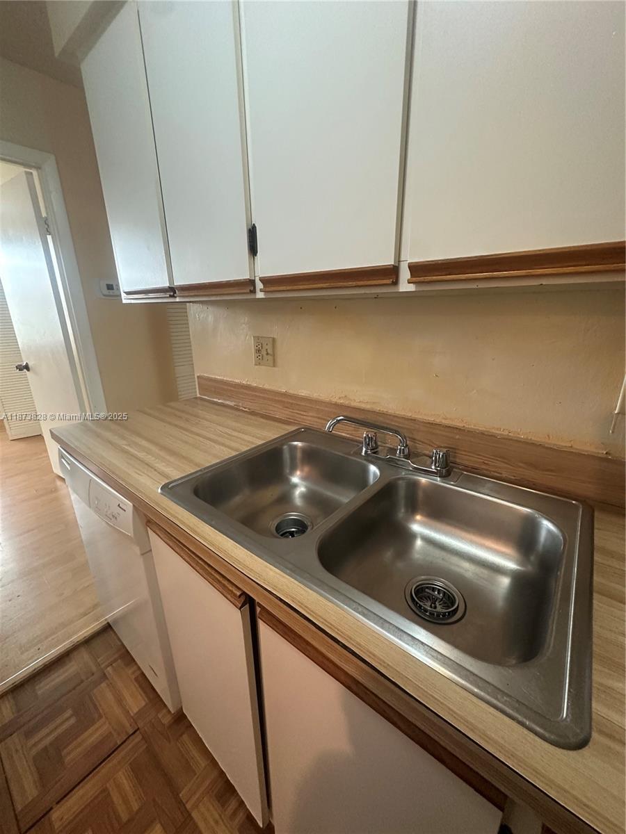 18318 Northwest 68th Avenue, Unit B Hialeah, FL 33015 - Photo 13 of 26 a close view of sink and stove