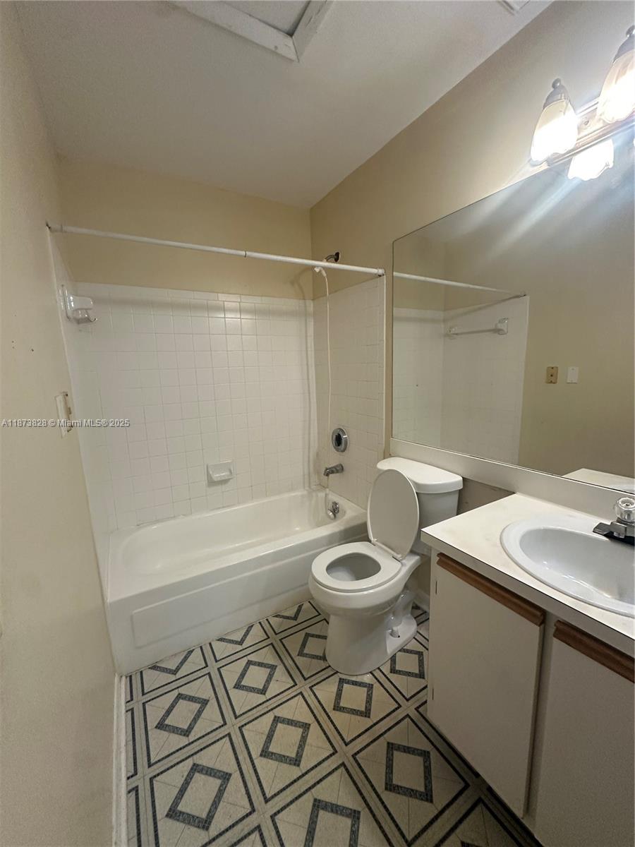 18318 Northwest 68th Avenue, Unit B Hialeah, FL 33015 - Photo 14 of 26 a bathroom with a sink toilet and shower