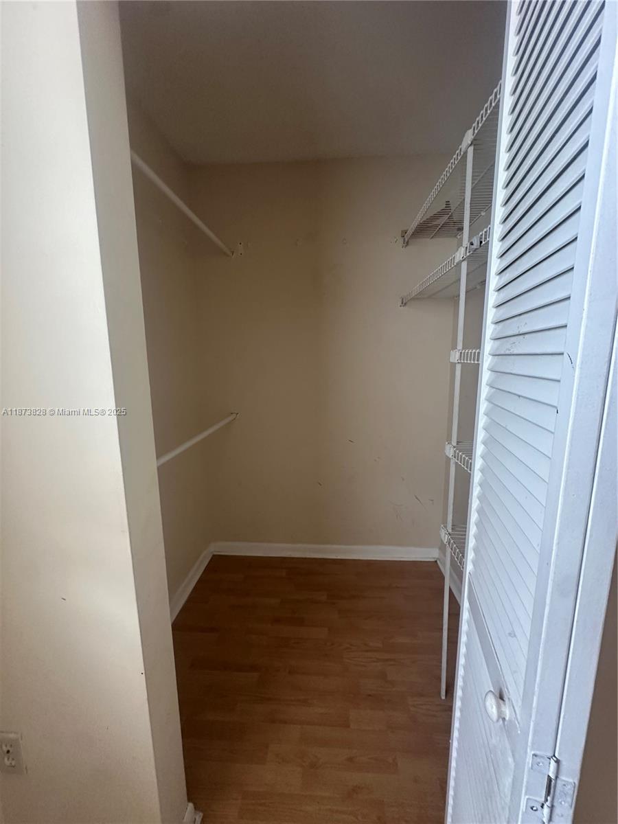 18318 Northwest 68th Avenue, Unit B Hialeah, FL 33015 - Photo 17 of 26 a view of wooden floor