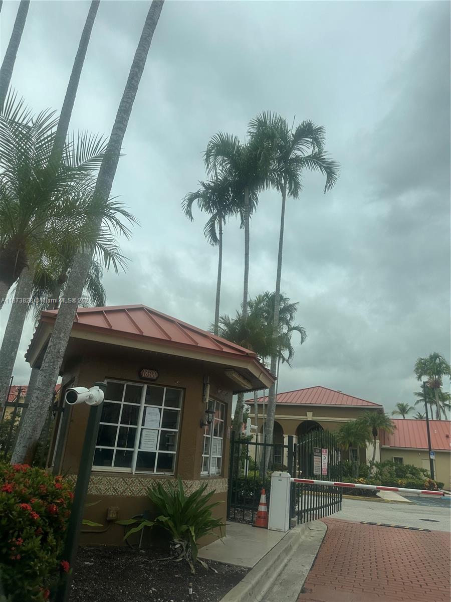 18318 Northwest 68th Avenue, Unit B Hialeah, FL 33015 - Photo 24 of 26 a front view of house with yard