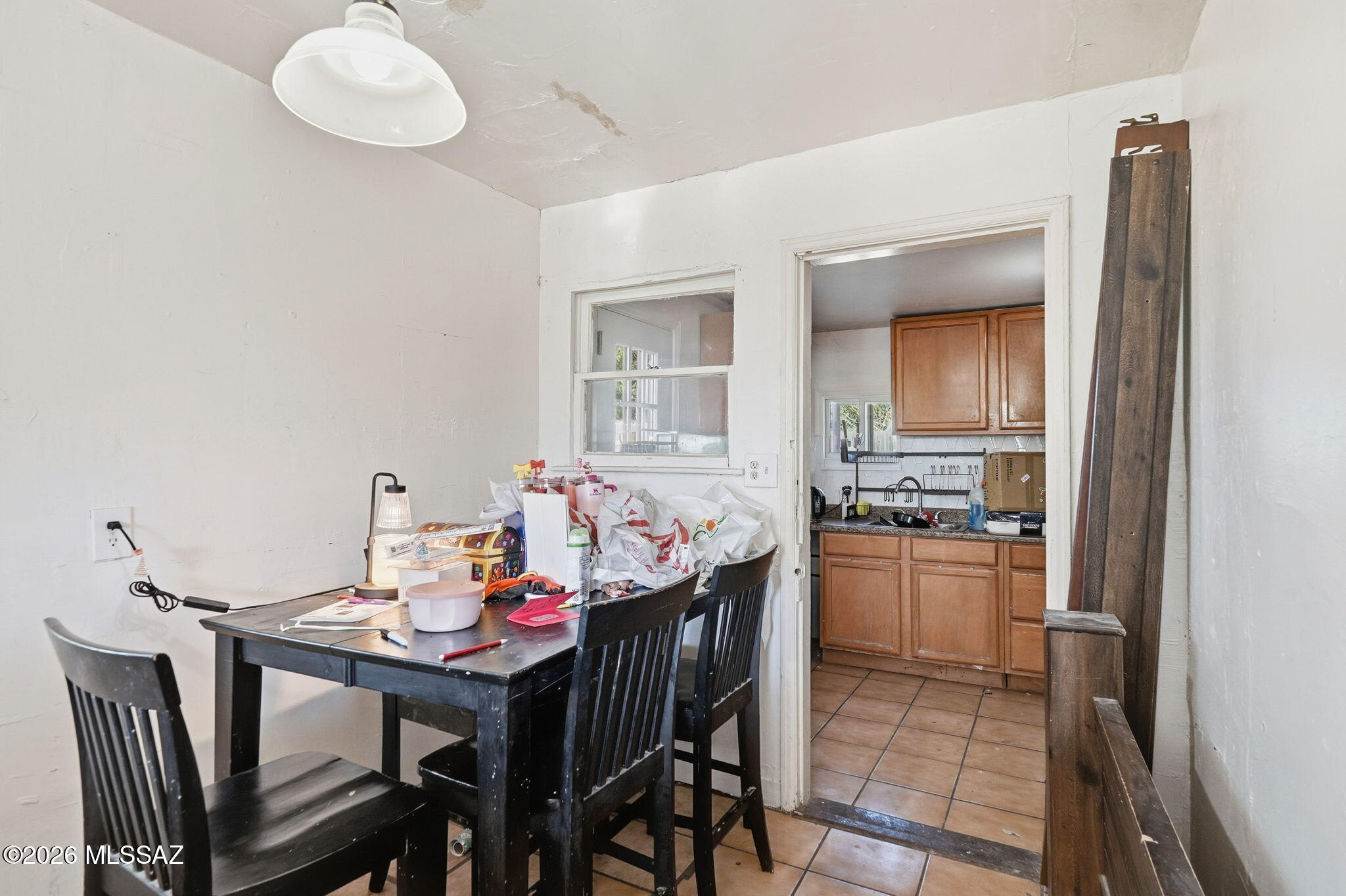 426 East Aragon Road, Unit 1 Tucson, AZ 85756 - Photo 6 of 18 a kitchen that has a table and chairs in it
