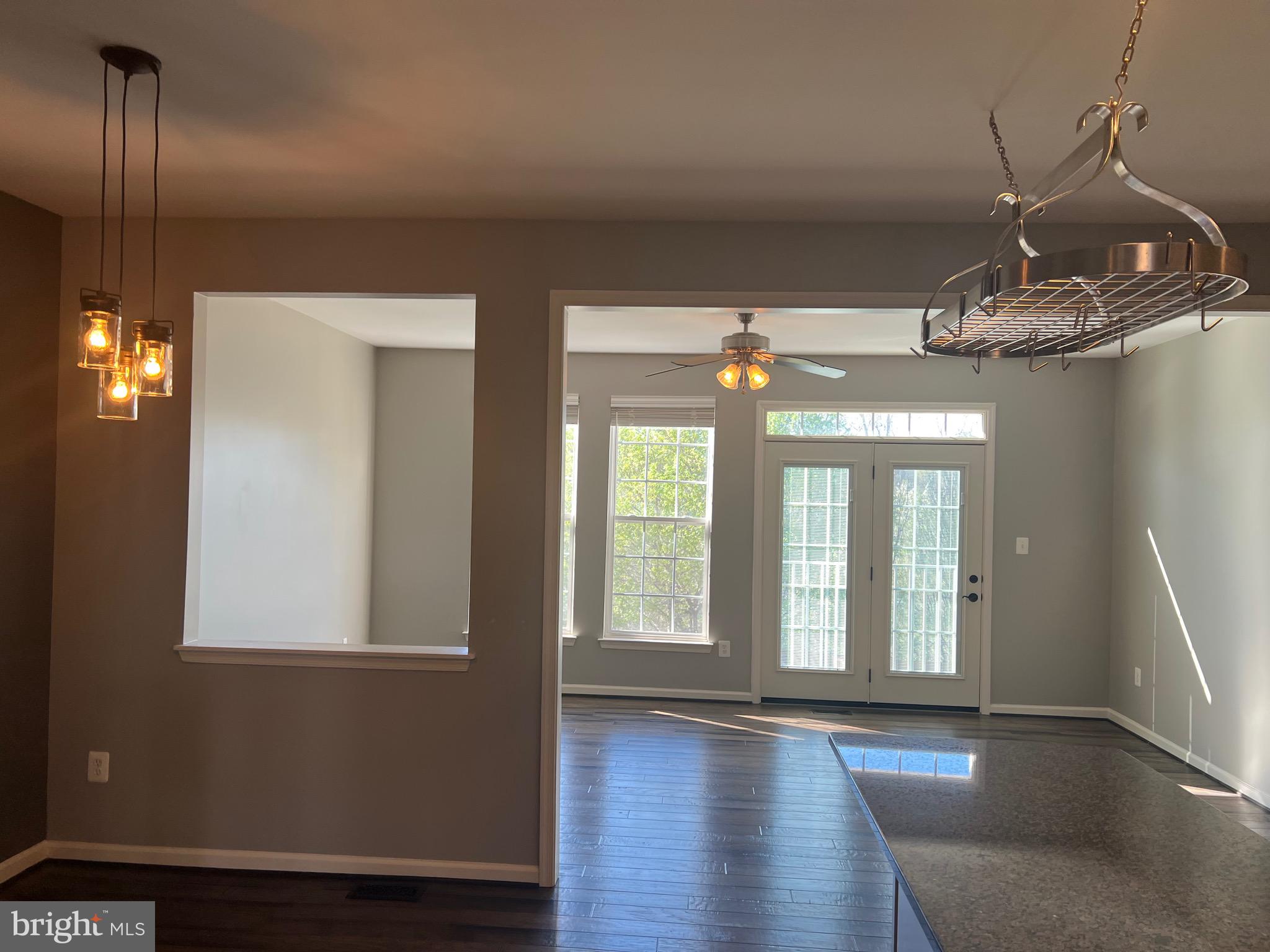 131 Fiona Way Brunswick, MD 21758 - Photo 20 of 73 a view of a room with wooden floor and windows