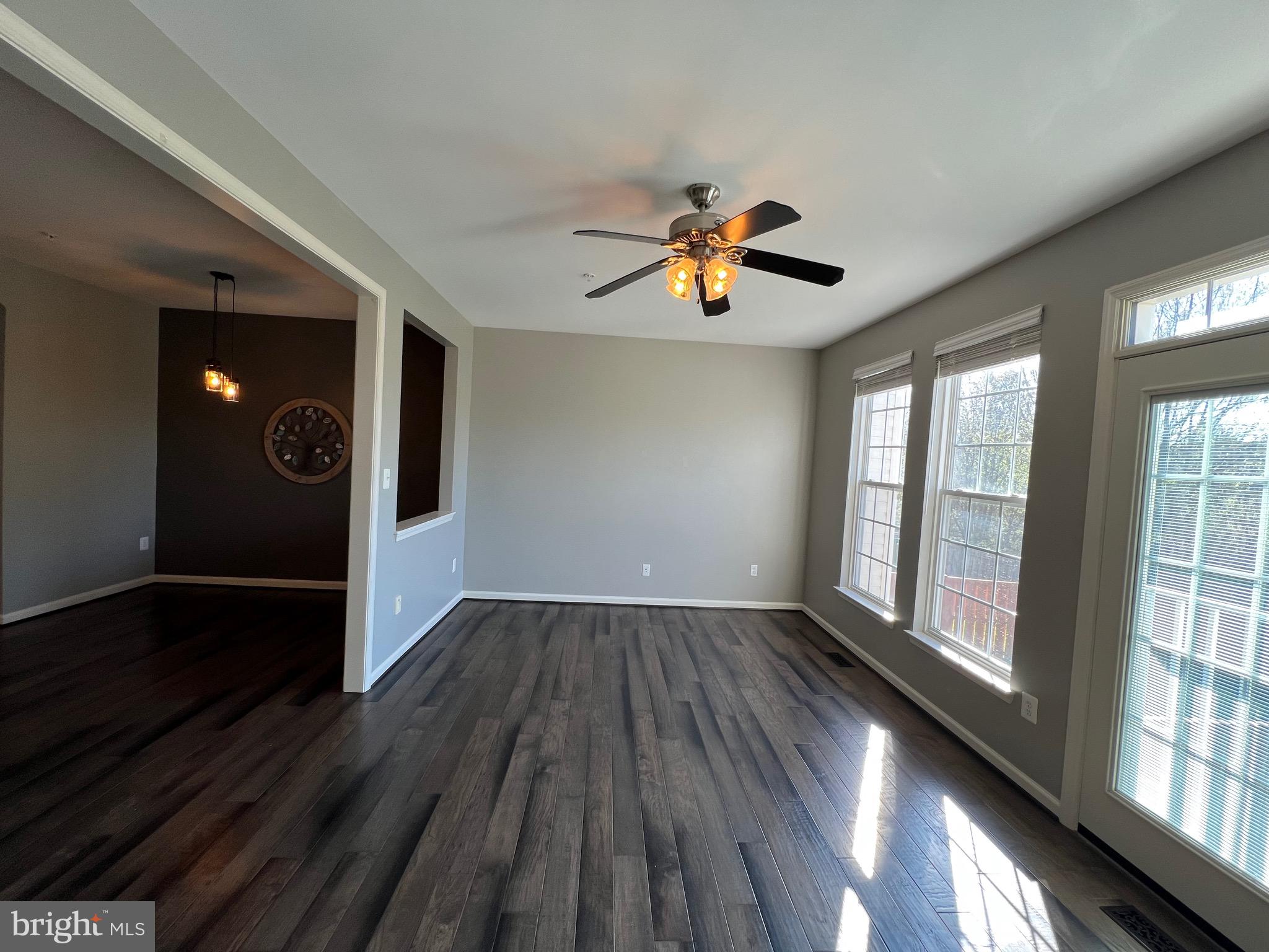 131 Fiona Way Brunswick, MD 21758 - Photo 29 of 73 wooden floor in an empty room with a window