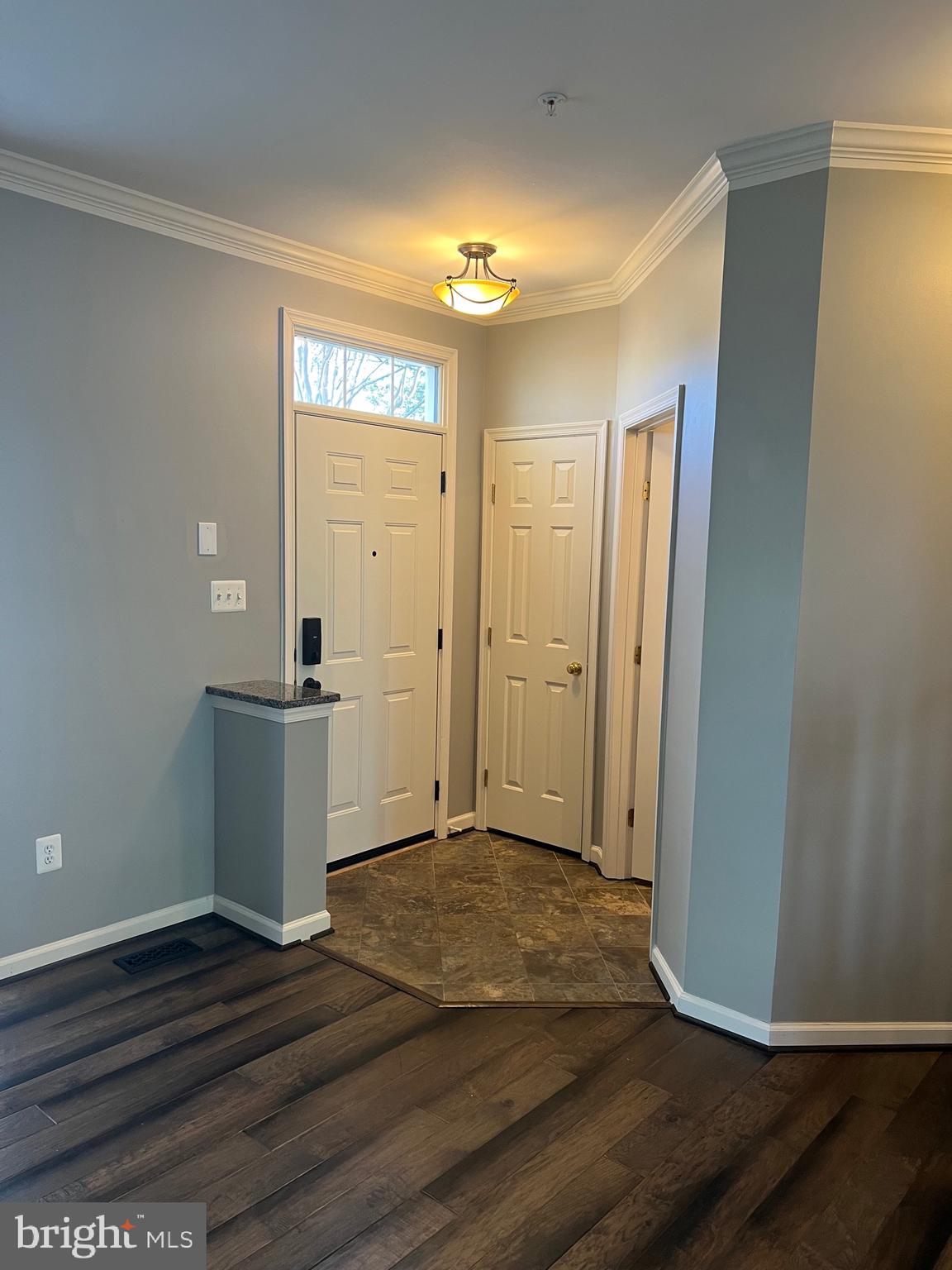 131 Fiona Way Brunswick, MD 21758 - Photo 4 of 73 an empty room with wooden floor and windows