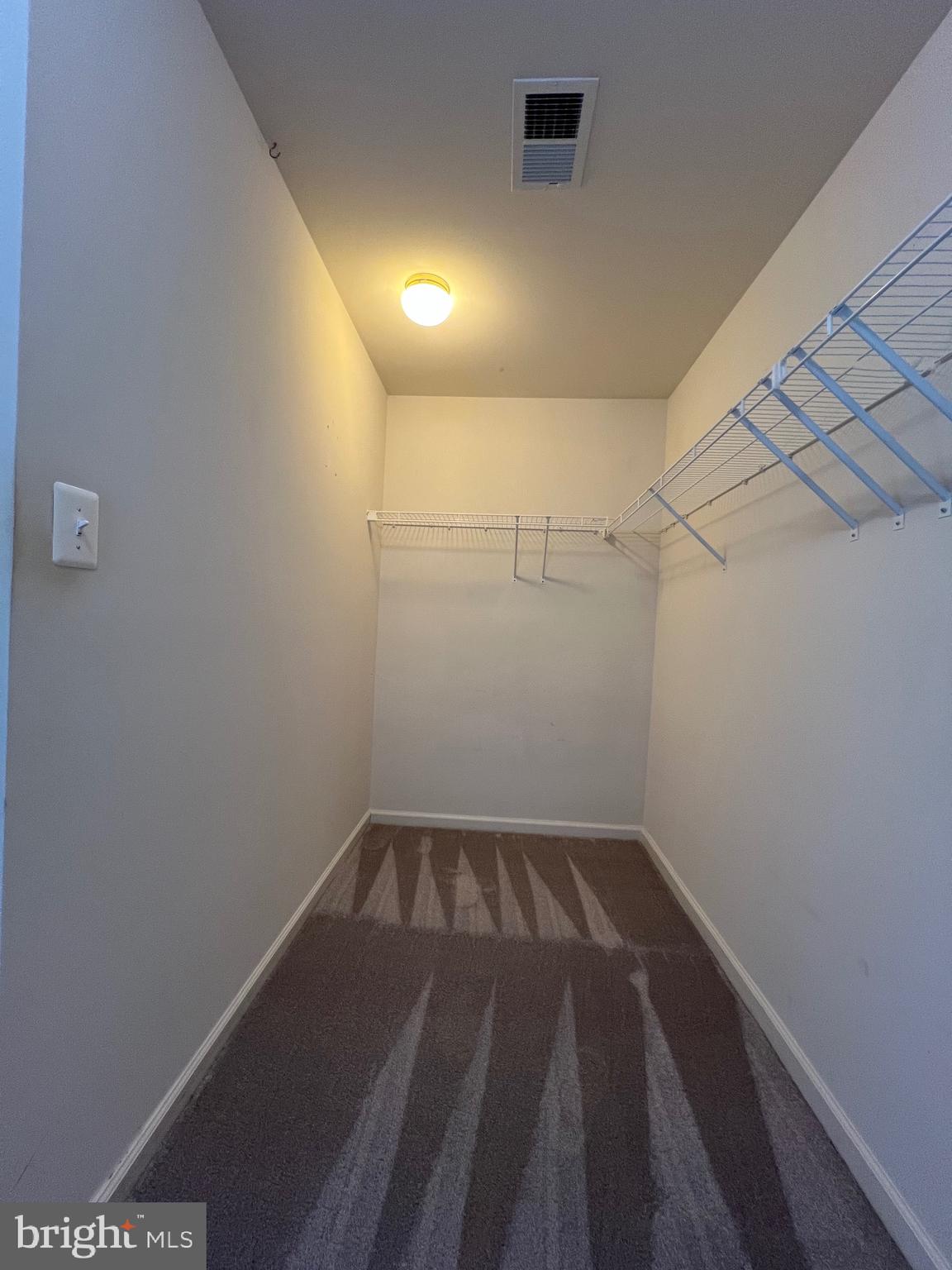 131 Fiona Way Brunswick, MD 21758 - Photo 59 of 73 a view of a room with empty racks