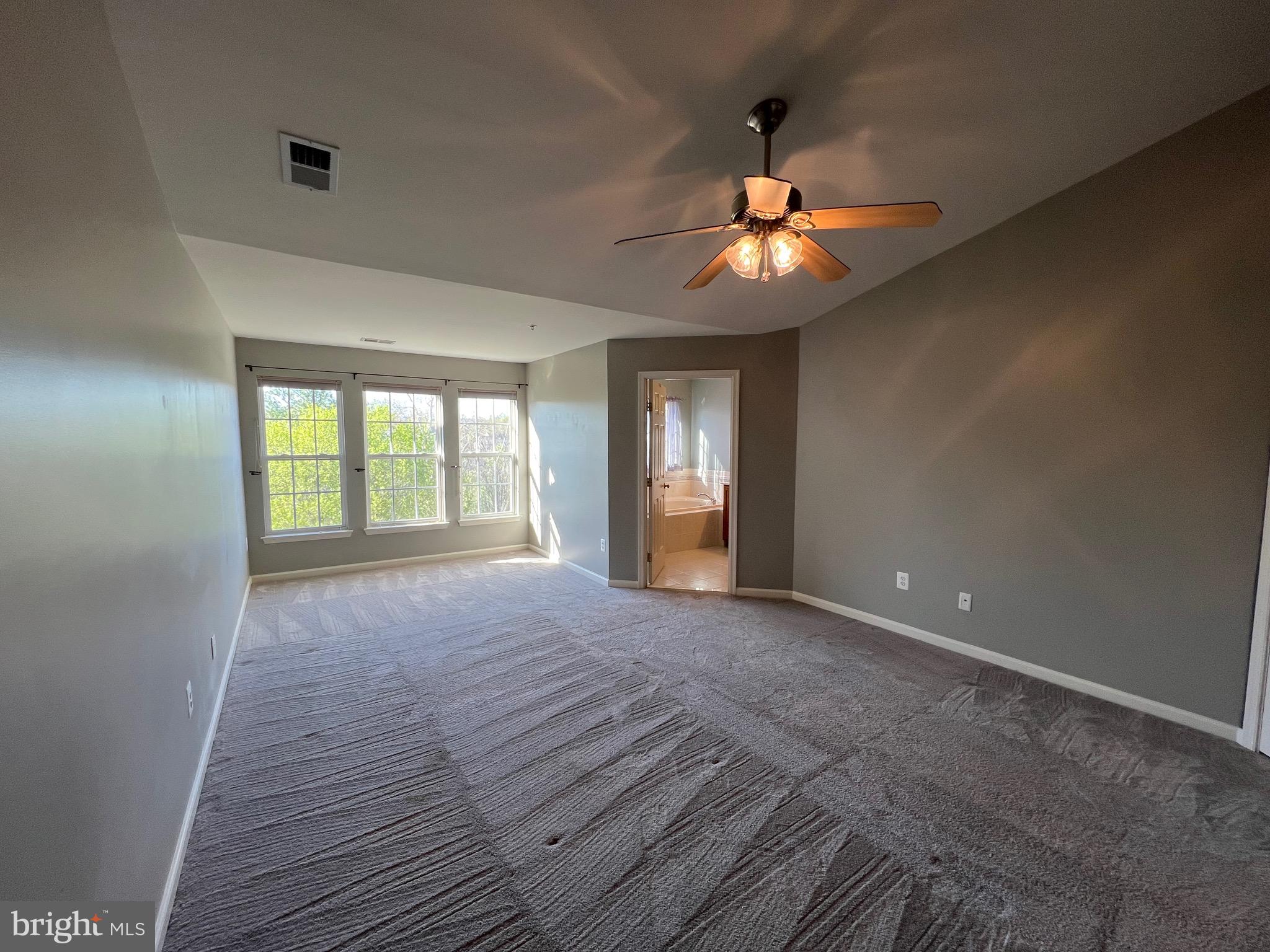 131 Fiona Way Brunswick, MD 21758 - Photo 60 of 73 a view of empty room with wooden floor and fan