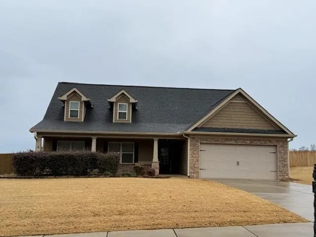 a front view of a house with yard