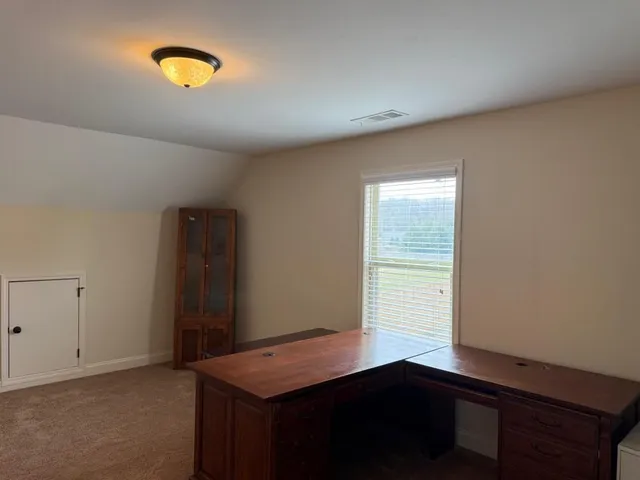 a room with a table and a window