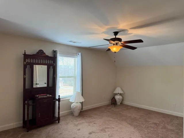 a man sitting on a bench in a room