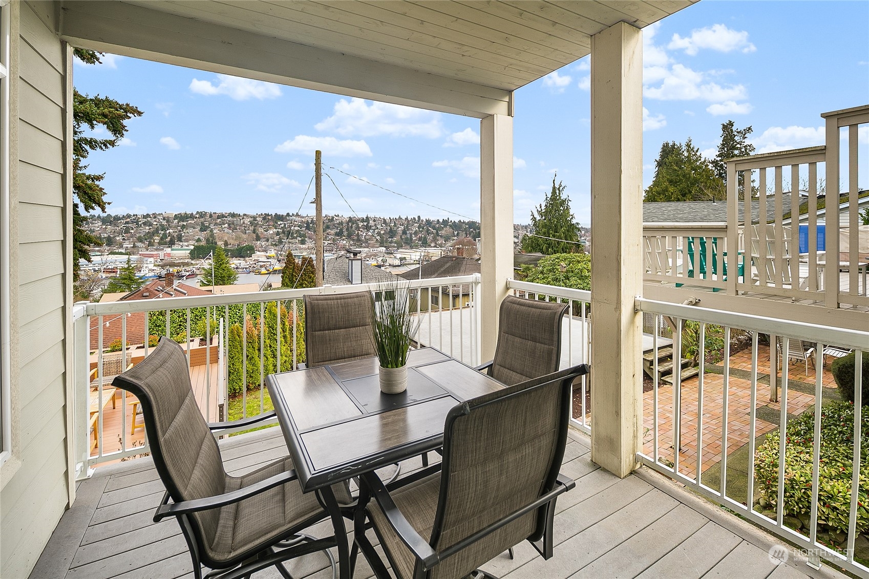 1020 West Ruffner Street Seattle, WA 98119 - Photo 13 of 39 a view of a balcony with a table and chairs