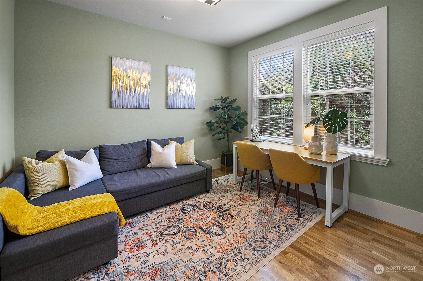 1020 West Ruffner Street Seattle, WA 98119 - Photo 15 of 39 a living room with furniture and a potted plant