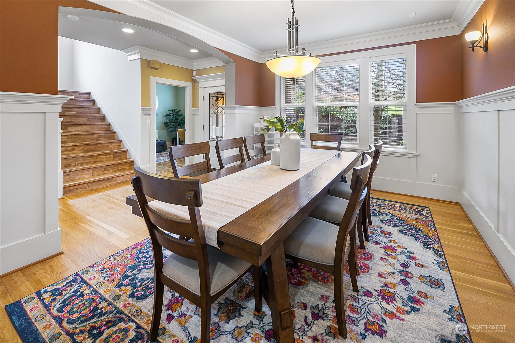 1020 West Ruffner Street Seattle, WA 98119 - Photo 2 of 39 a view of a dining room with furniture and wooden floor