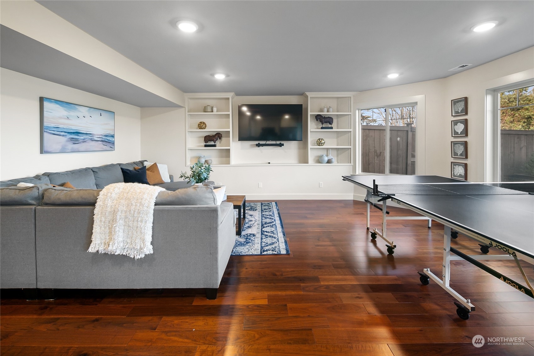 1020 West Ruffner Street Seattle, WA 98119 - Photo 24 of 39 a living room with furniture and a flat screen tv
